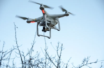 drone in the air with blue sky behind